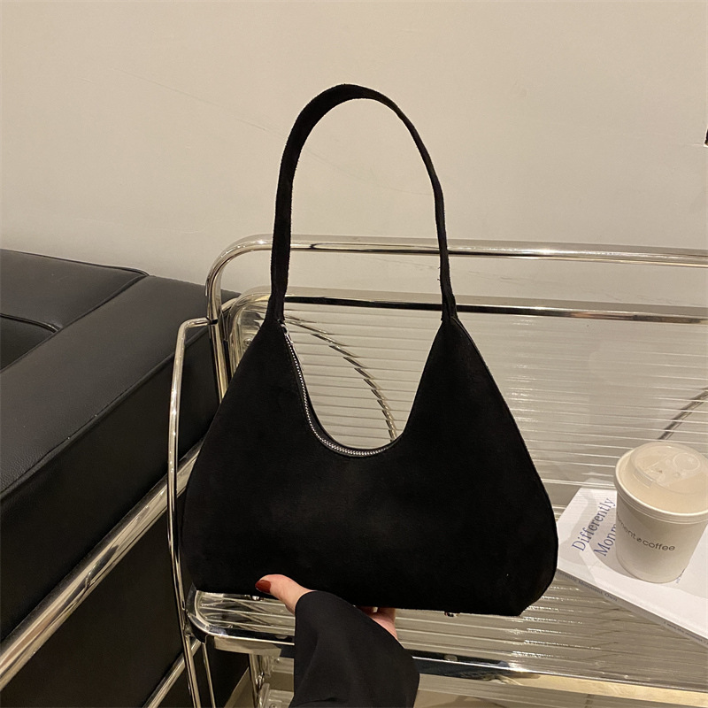 Bolsa de mano de textura retro coreana para mujeres 2025 primavera nuevo estilo de viaje al trabajo molido bolso de hombro axilla
