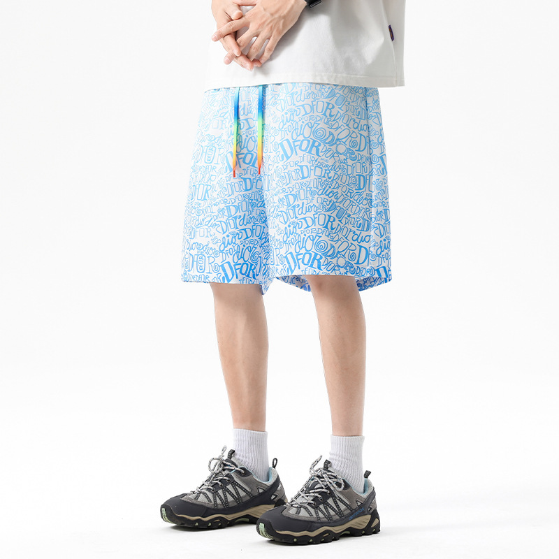 Verano nuevo estilo adolescente pantalones cortos deportivos moda casual gradiente pantalones cortos de camuflaje pantalones sueltos de playa