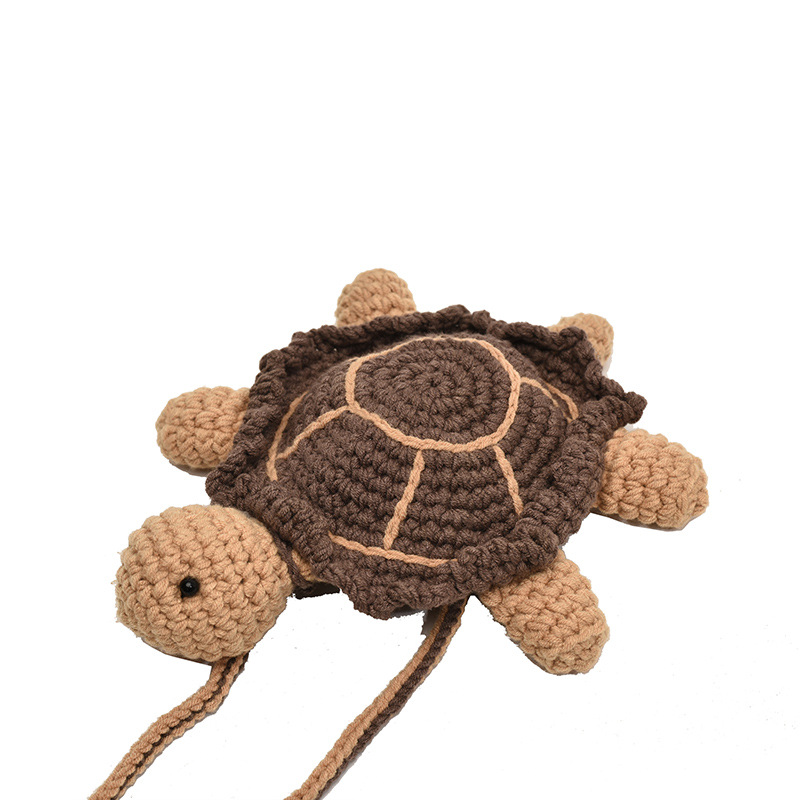 2025 otoño y invierno nuevo bolso infantil lana gancho tejido pequeña tortuga bebé bolso de cambio caricatura lindo mochila de hombro
