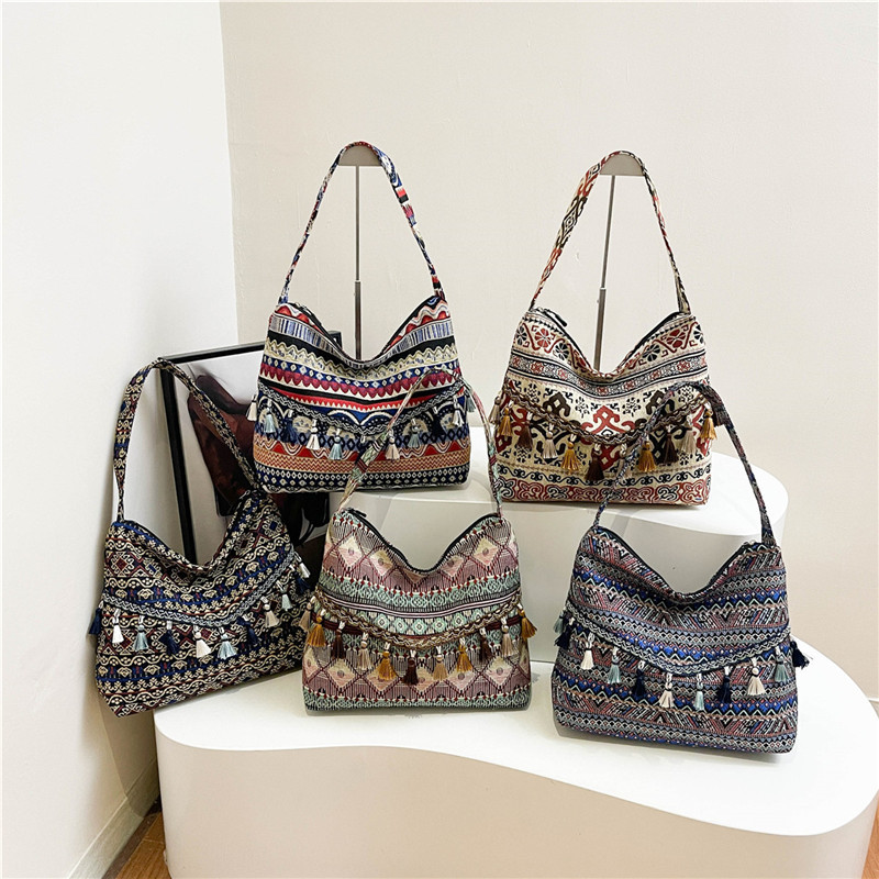 Bolsos de gran capacidad de estilo nacional para mujeres 2025, nueva moda extranjera, bolsas de hombro de borda, bolsas de compras al aire libre