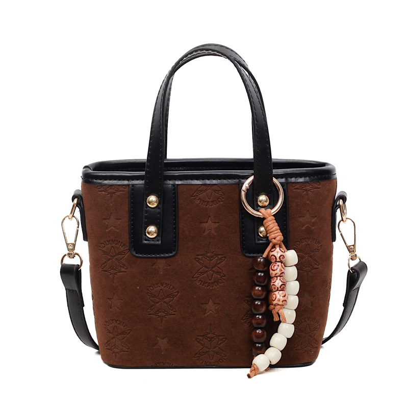 Popularidad transfronteriza retro bolso de cubo portátil para mujeres otoño / invierno 2025 nueva moda versátil bolso de hombro simple mochila