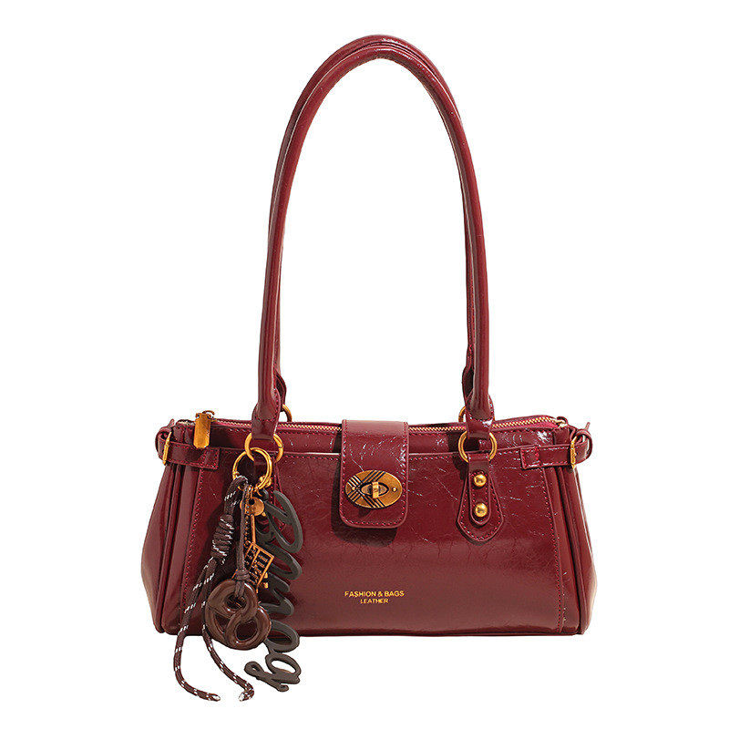 Bolsa de brazo de viaje coreano, bolso de cera retrógrada para mujeres, bolso de palo de piel de aceite 2025, nueva moda versátil bolso de hombro portátil