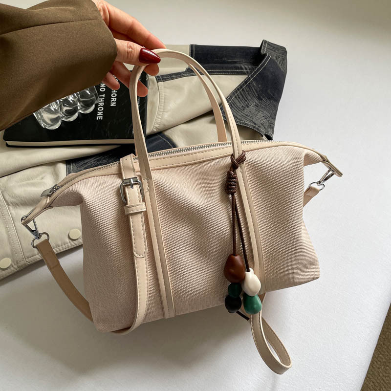 Bolsa de mano de gran capacidad de viaje coreano para mujeres 2026 nueva moda de verano simple bolsa de hombro retro
