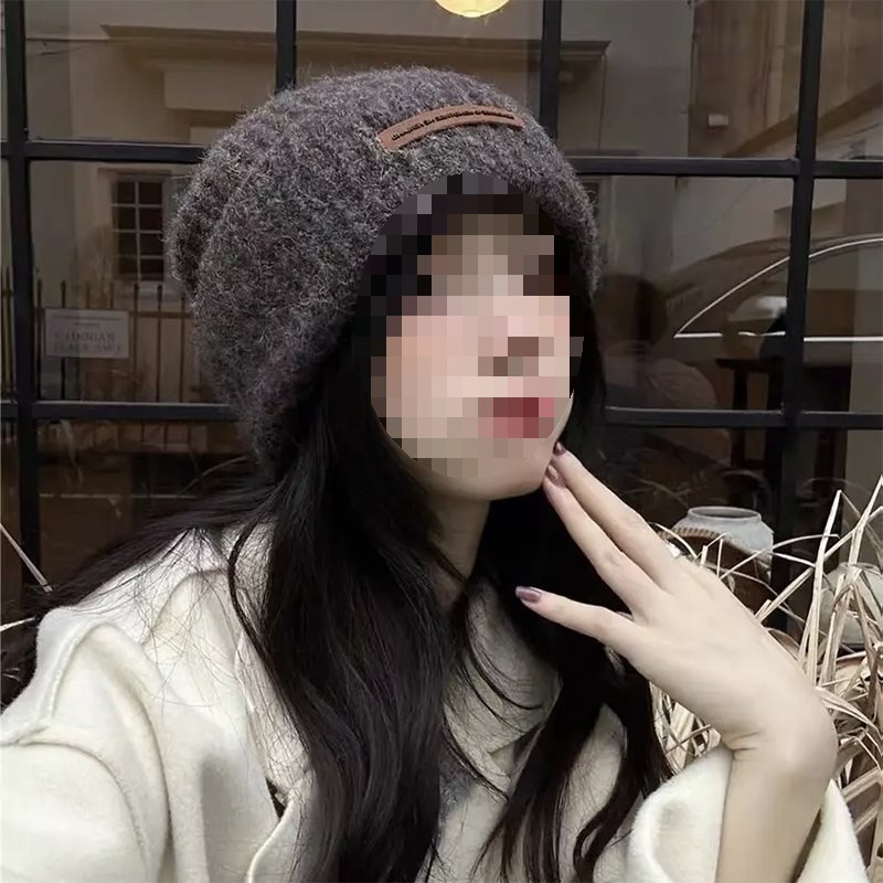 Woolen demi-season capacious knitted hat