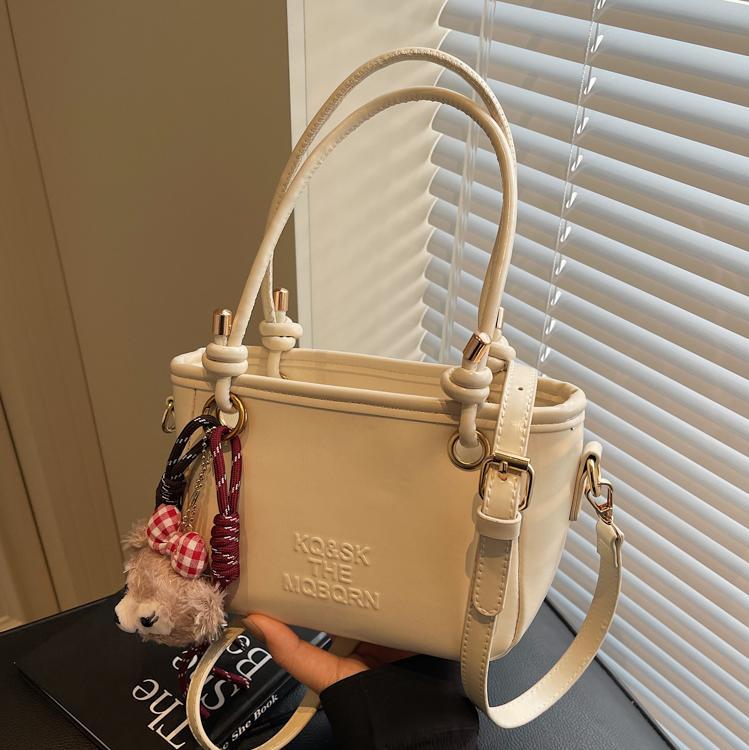 Bolsa de cubo retro explosiva para mujeres 2025 nuevo bolso de nicho de diseño de alta humedad versátil bolso de hombro