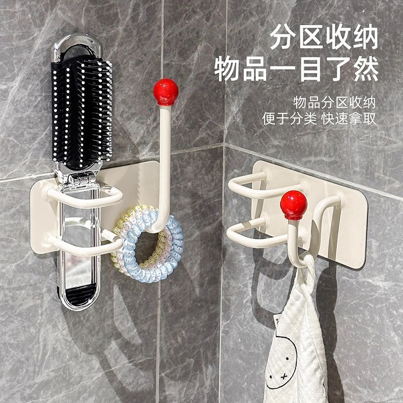 トイレの髪輪のカチューシャのひもは浴室の壁掛けの収納棚をフックします。|undefined