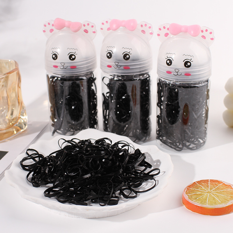 Caja de dibujos animados para niños pequeños tiras de goma coloridas tiras de goma desechables engrosadas de tracción de anillo de pelo adornos para el cabello