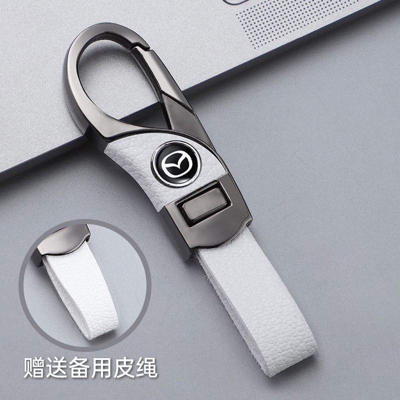 Llavero de automóvil transfronterizo, logotipo del automóvil, cientos de apellidos, botones de cuero de alta gama, colgante de llavero de negocios simple y personalizado