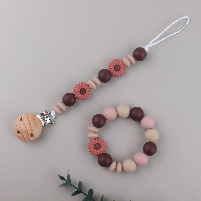 Nueva margarita pequeña cadena de tetina para calmar a los bebés anti-caída cadena creativa DIY pulsera de goma de diente dos conjuntos