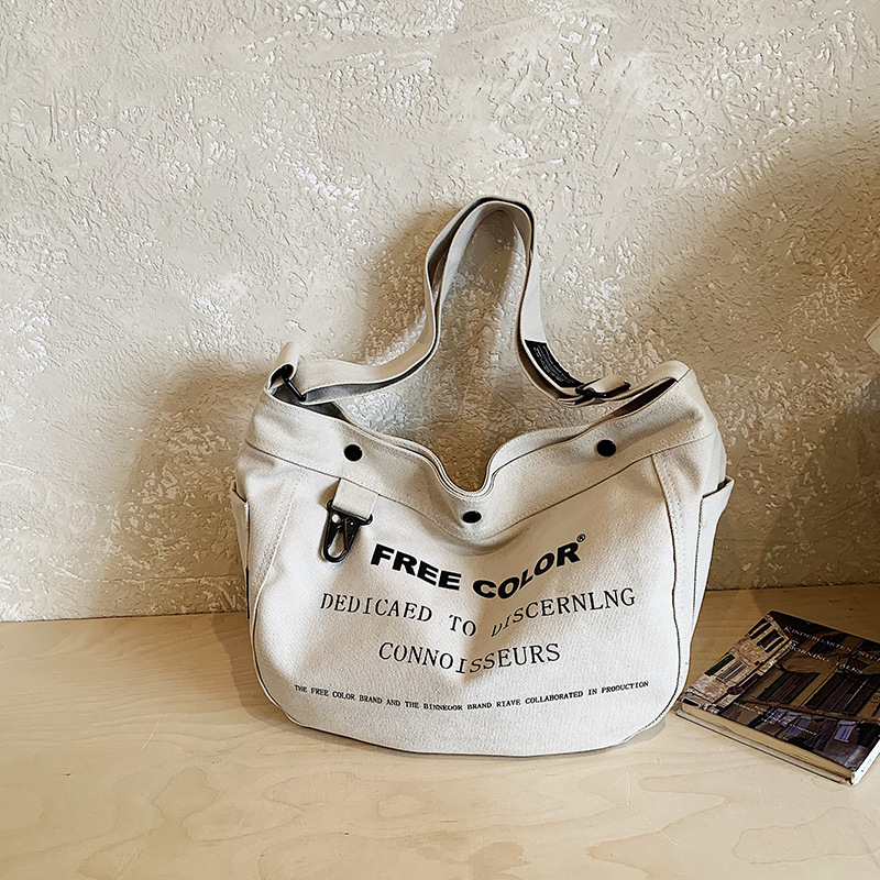 Bolsa de lona para mujeres 2026 nueva bolsa de gran capacidad transfronteriza impresa letras de viaje casual mochila de hombro