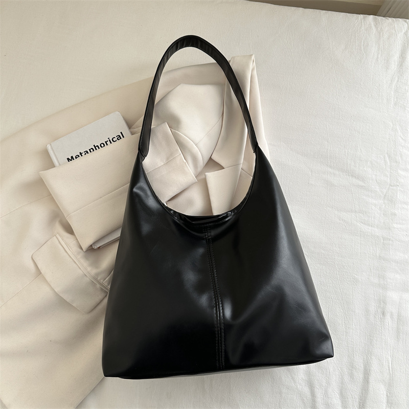 Bolsa de mujer de gran capacidad, textura de 2024, nueva moda simple, bolsa de hombro universal, bolsa de brazo de viaje de color.