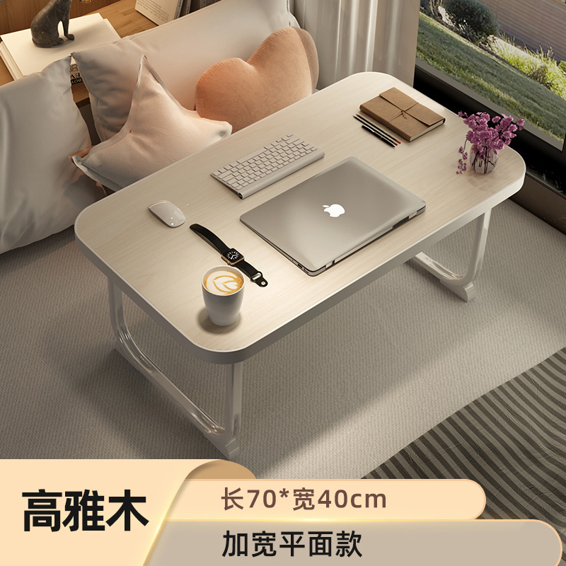 ベッドの上の机は折りたたみます。|undefined