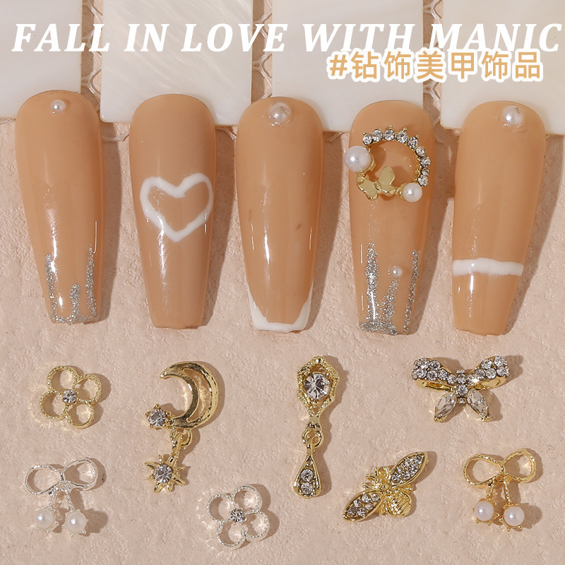 Japanese and Korean nail art new jewelry pearl astronaut alloy nail drill butterfly bear drill nail jewelry wholesale