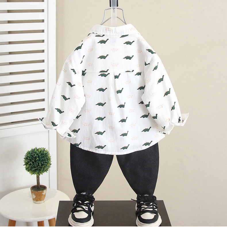 6268 Camisa de dinosaurio de dibujos animados para niños Otoño 2025 Nuevo estilo guapo bebé primavera y otoño Camisa de manga larga para niños