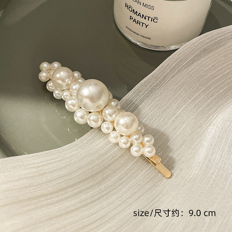 Corea del Sur clip para el cabello de perlas en línea clip para el cabello de mujeres rasgadas clip para el cabello de una palabra clip para el cabello de bordes fría BB clip lateral clip para el temperamento clip para la cabeza