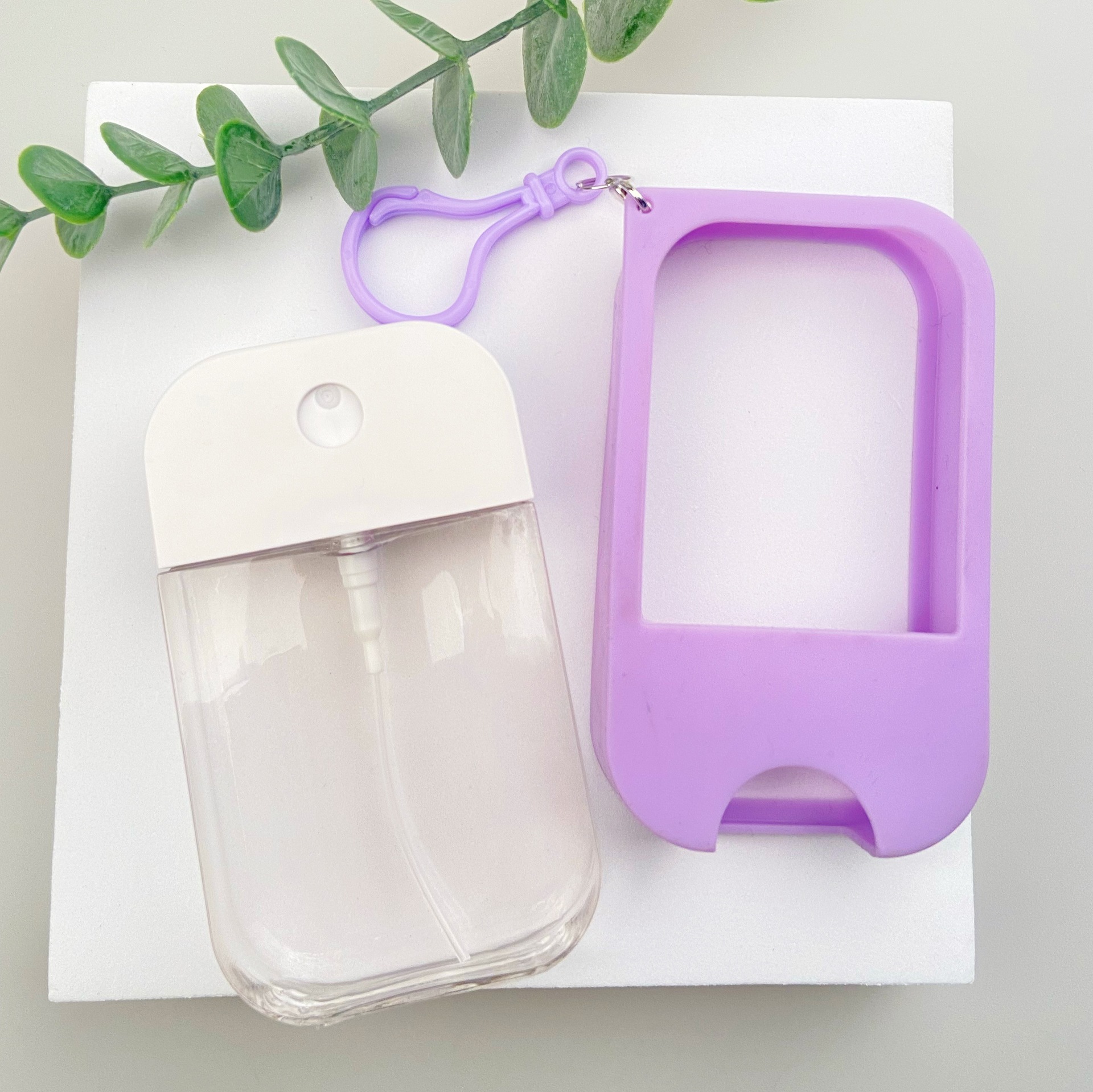 50; botella + boquilla + funda de goma; PETG