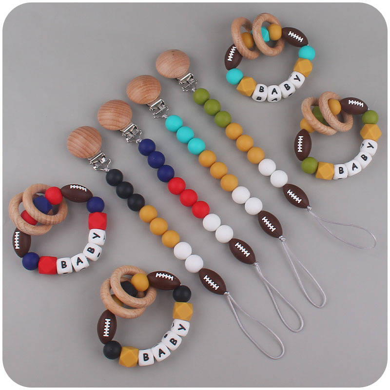 Nuevo bebé suministros de dibujos animados rugby mordedor chupete cadena calmante bebé DIY pulsera mordedor conjunto de dos piezas