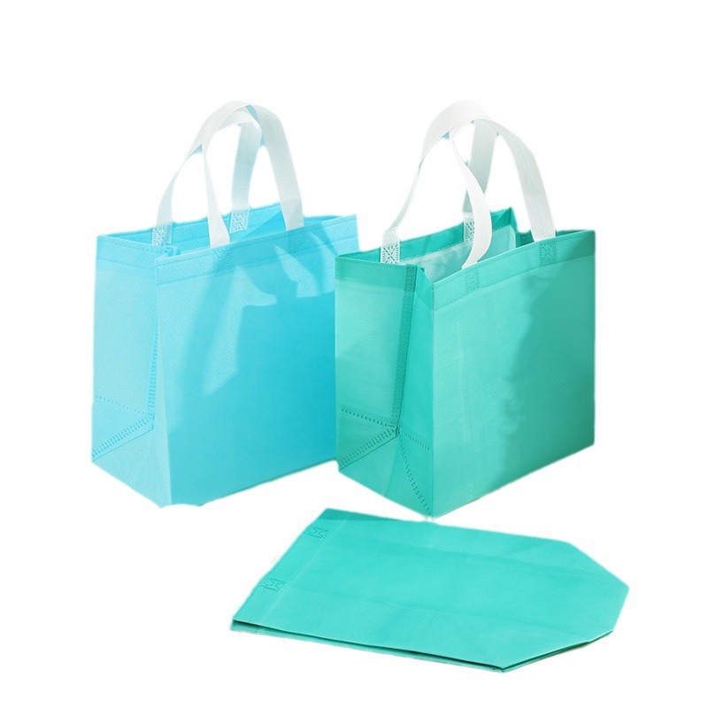 En stock bolso no tejido recubierto al por mayor bolsa de protección del medio ambiente bolsa de tienda de ropa bolso de compras engrosado logotipo imprimible