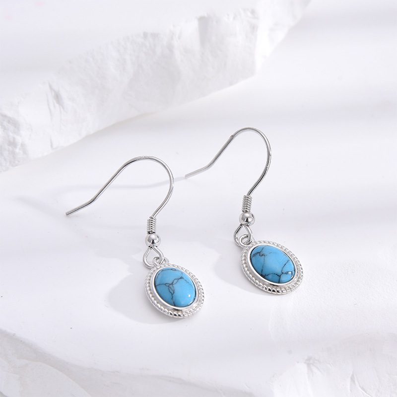 S925 plata esterlina turquesa pendientes nicho femenino retro Europa y América de moda ligera lujosa atmósfera alta sensación pendientes de orejas