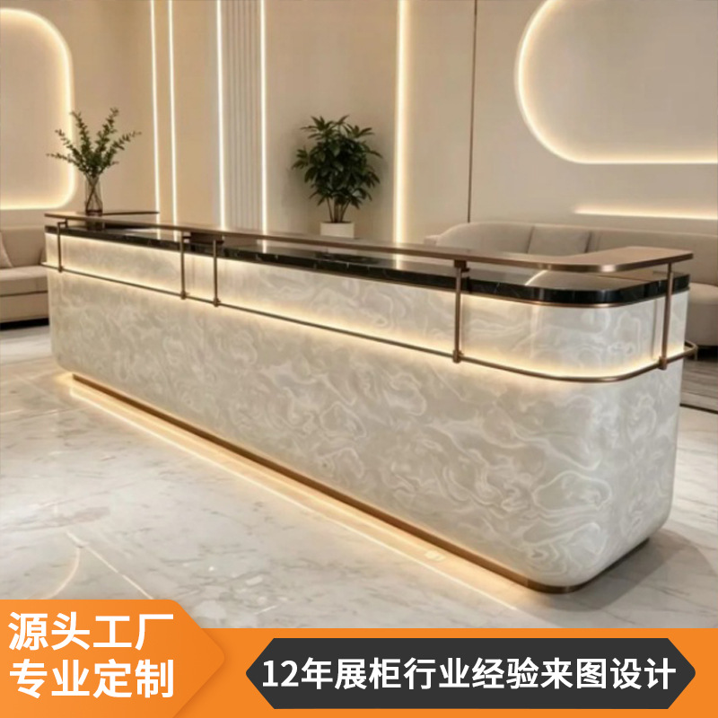 Custom-made reception desks for companies, hotels, and luxury clothing stores, featuring creative illuminated strip lighting