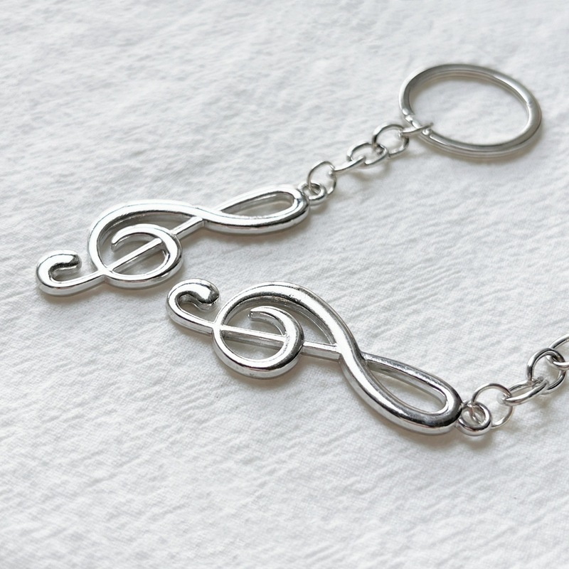 Factory direct creative exquisite gift music symbol key chain personality music symbol key chain luggage pendant