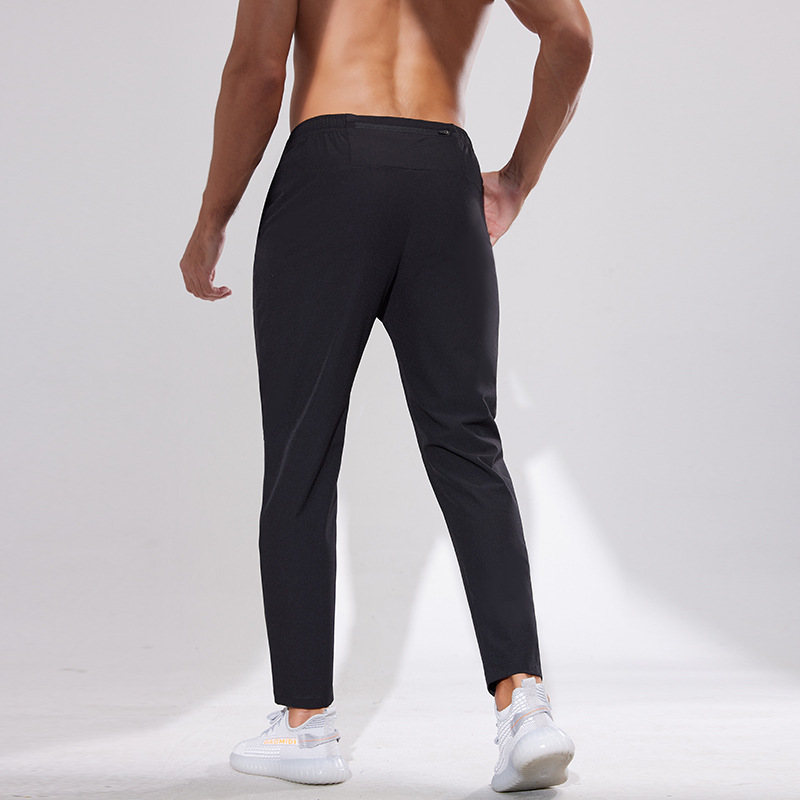 Pantalones deportivos al aire libre Otoño e Invierno hombres corriendo fitness pantalones de secado rápido sueltos transpirables deportes casuales pantalones de entrenamiento de secado rápido