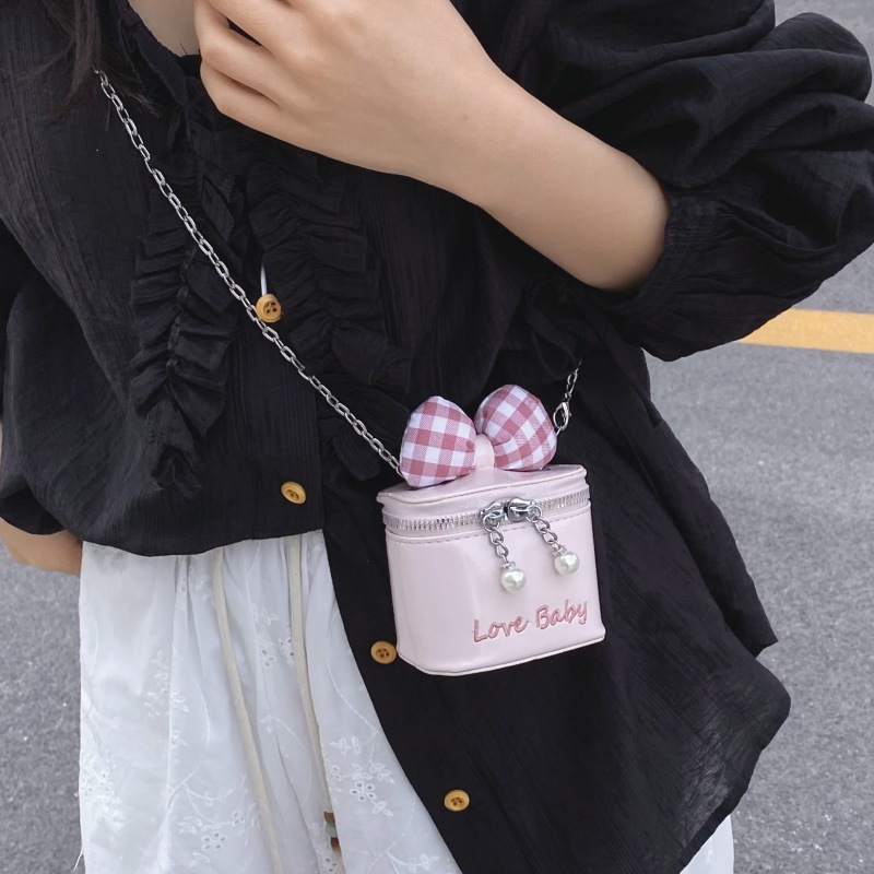 Bolso de cubo de moda coreana 2025 verano nuevo bolso femenino lindo lazo bolso de hombro mini cadena bolso de mensajero