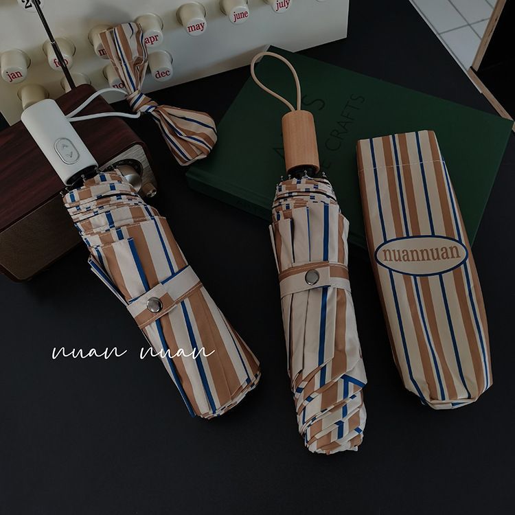 アメリカンレトロストライプ高颜値雨伞レディース折り畳み晴雨両用日焼け止め紫外线耐风日伞インスタ