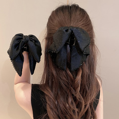 黒い蝶結びのリボンは女性のフランス式の高級感を持っています。
