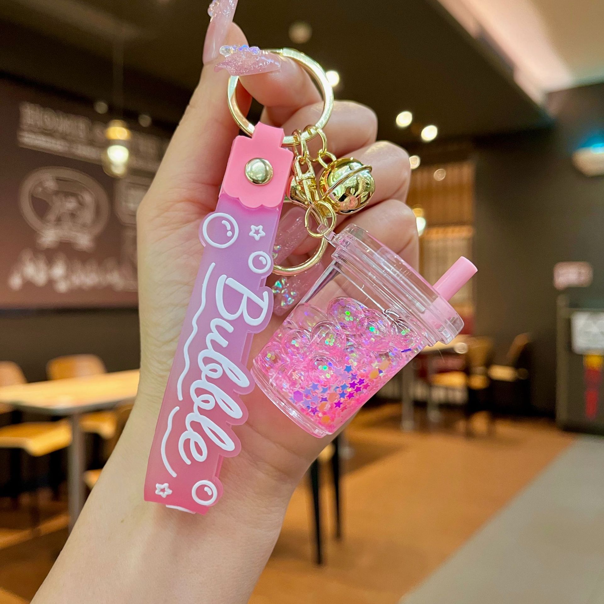 Aceite de gato garra arenas movedizas llavero lindo dibujos animados cadena colgante captura muñeca máquina agarrar pequeño regalo al por mayor