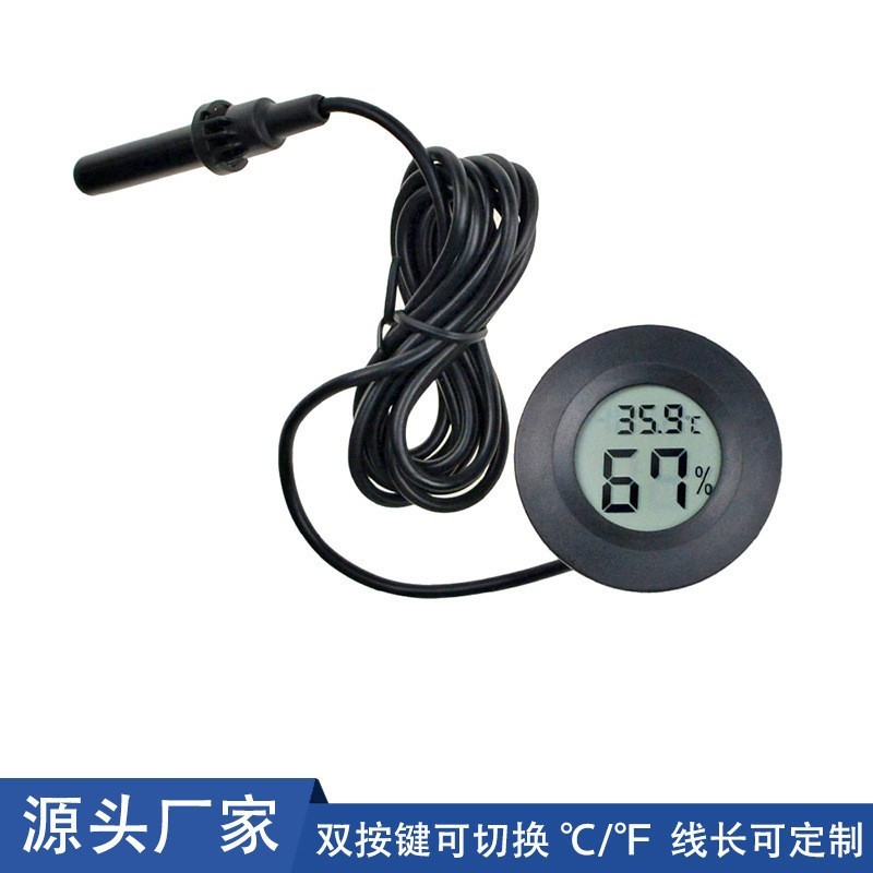 円形埋め込み型デジタル温湿度計シガーのワインキャビネットは電子温湿度計のプローブを持っています。|undefined