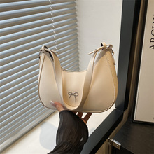 新款蝴蝶结饺子包时尚纯单肩色单肩包包质感2025休闲腋下包月牙包