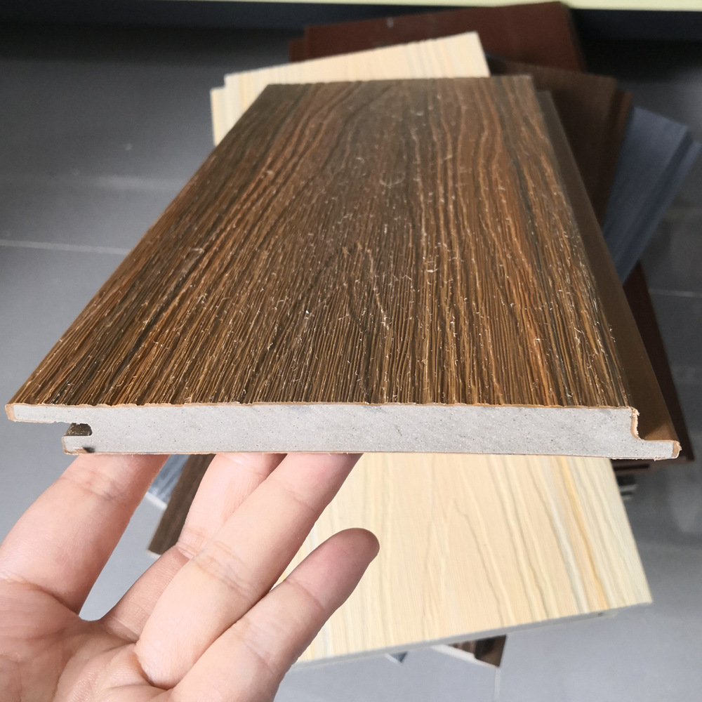 Exportación a Asia Rejilla de grano de madera Tablero de pared de madera de plástico al aire libre Tablero de pared decorativo al aire libre Tablero de pared grande de plástico de madera de pared exterior coextruido