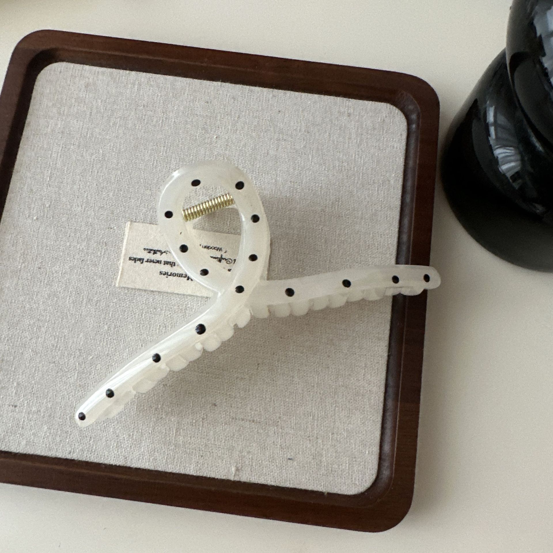 White polka dot cross