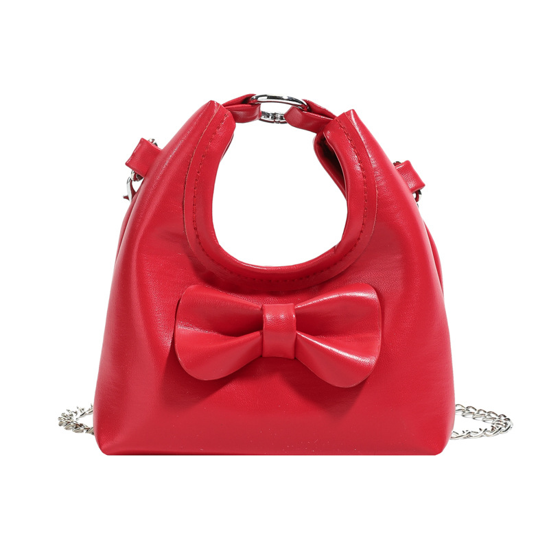 Dolce y lindo arco de hombro de niñas bolso de cadena mini pequeño bebé bolso de mano bolso de comercio exterior transfronterizo bolso de niños