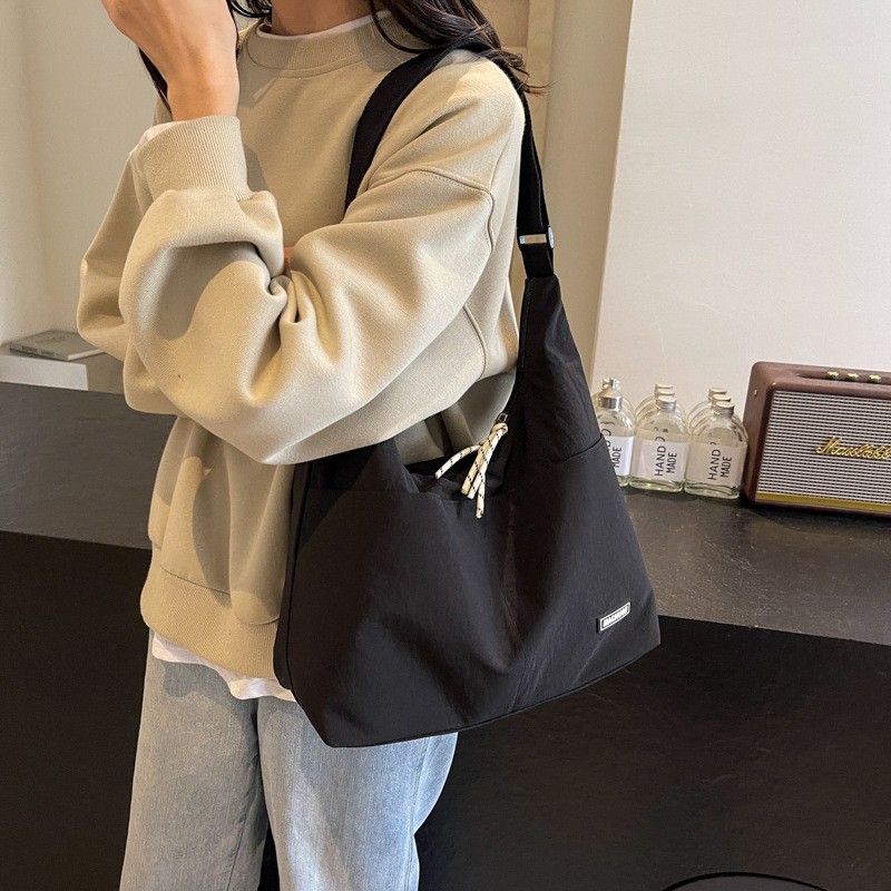 Bolso Tote de todo fósforo de moda para mujer 2024 nuevo bolso de hombro coreano popular de este año bolso de clase de gran capacidad para estudiantes universitarios