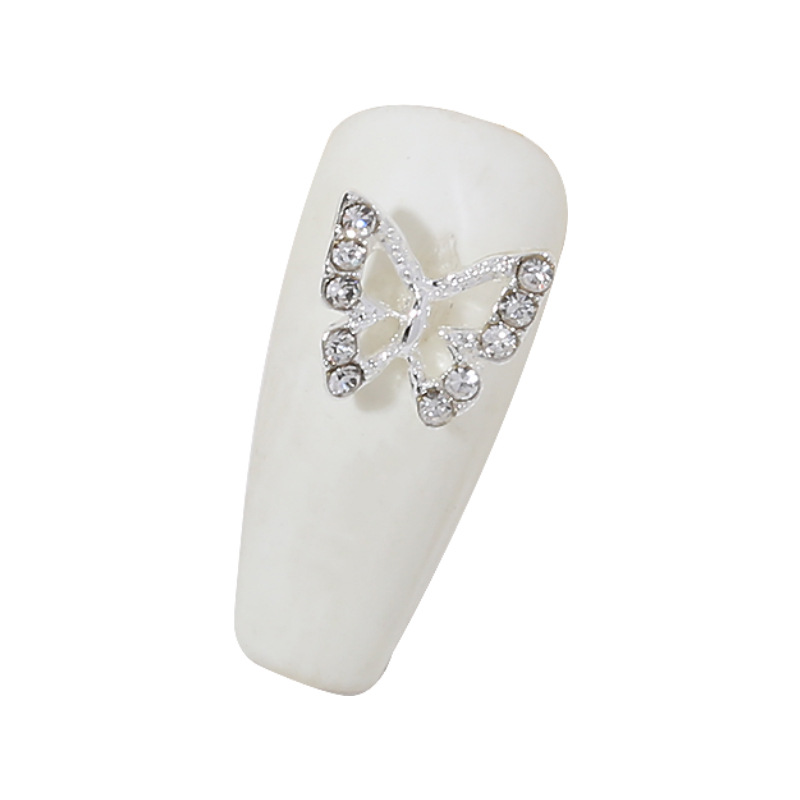 Venta caliente taladro de uñas arco de plata joyería tridimensional flash diamante esmalte de uñas decorativo diamante acabado pieza de uñas traje de joyería