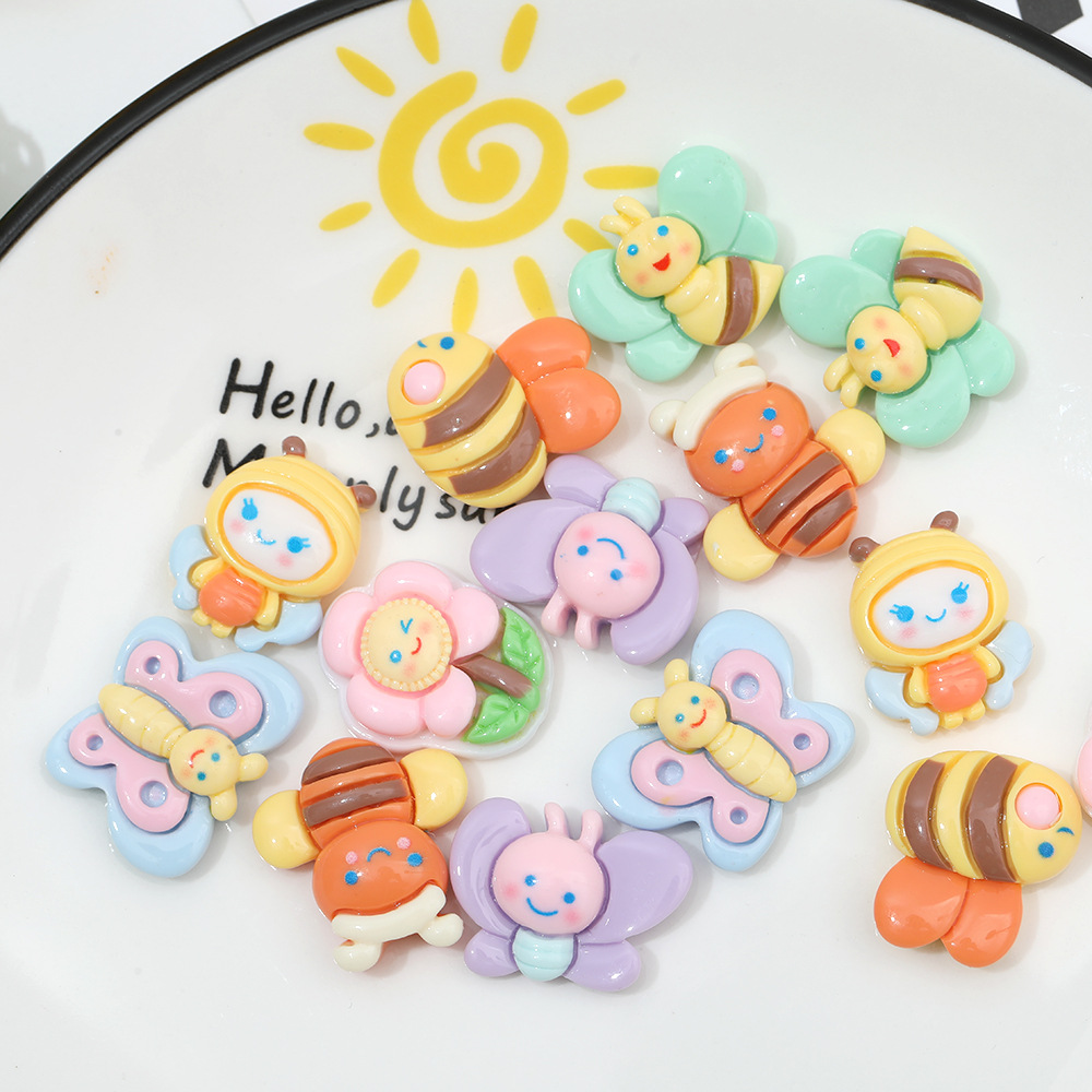 Macaron color pastoral abeja mariposa resina accesorios DIY crema pegamento accesorios para el cabello teléfono móvil Shell accesorios hechos a mano al por mayor