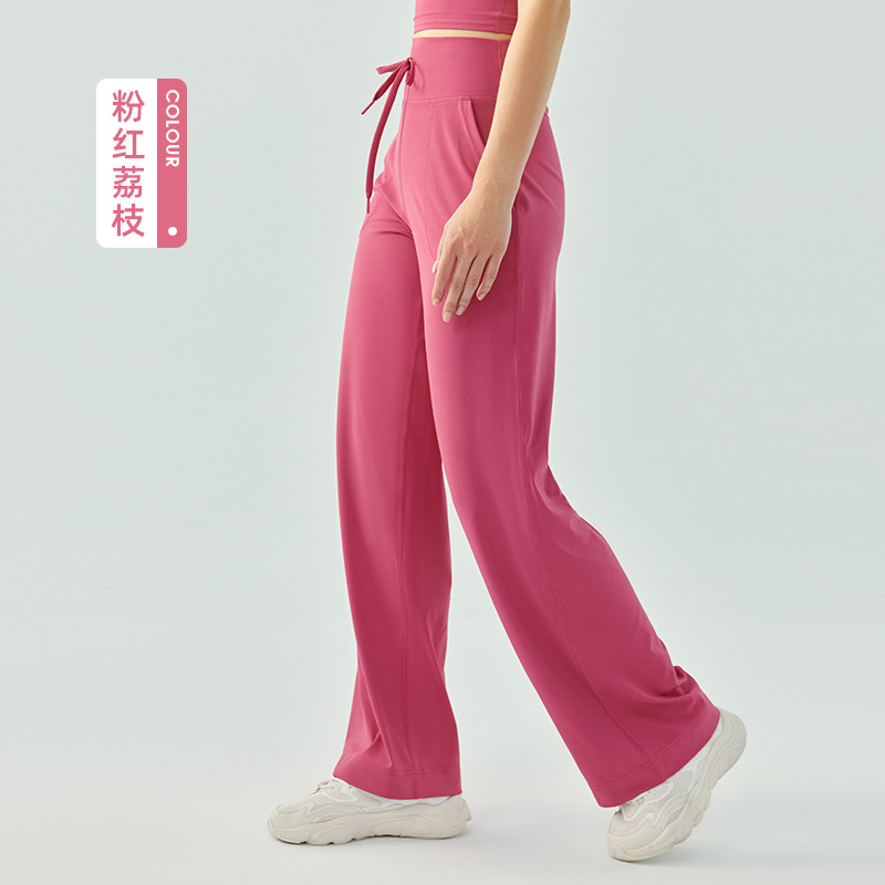 裸感の高い腰のひもの運動のズボンの女性のゆったりしている広脚の純色のフィットネスのズボンのランニングはスリムに見えます。