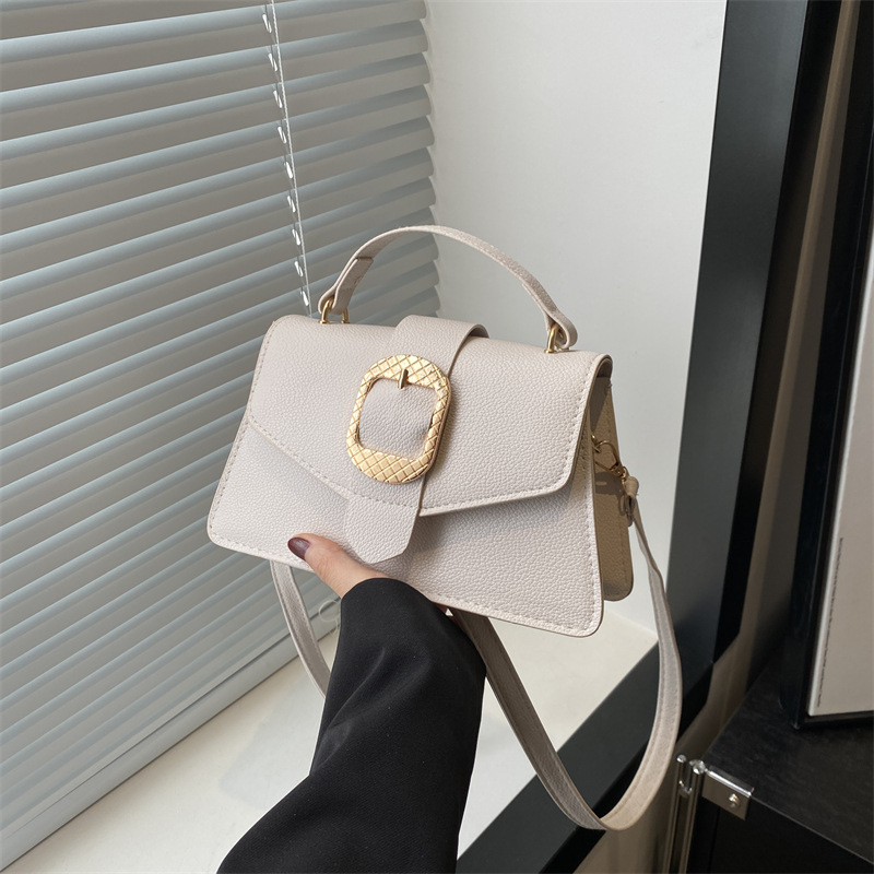 Bolso de primavera para mujeres, bolso de mano para viajar, simple bolso de hombro sólido.