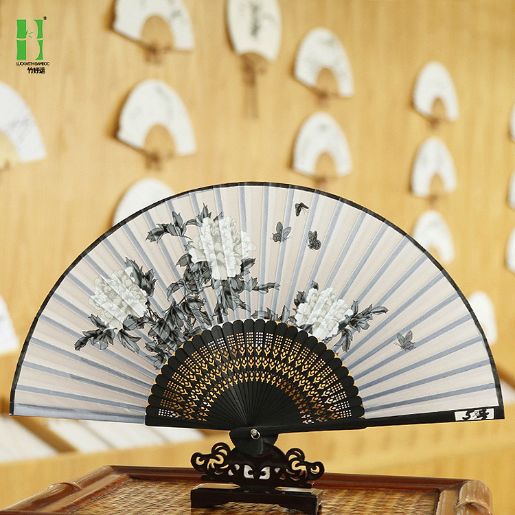 Ventilador antiguo estilo al por mayor Fan bolsa traje artesanía regalo ventilador cara de seda ventilador de publicidad estilo chino plegable ventilador femenino al por mayor