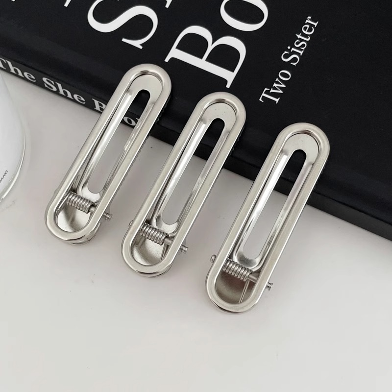 Fijación de cabello de metal fría plata en forma de clip de nariz de pato temperamento agujero estrellas clip de cabello frente lateral clip de cabello roto mujer