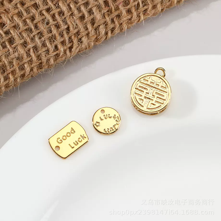 锌合金手缝标牌定制 英文字母服饰裤子箱包圆形缝线金属五金配件