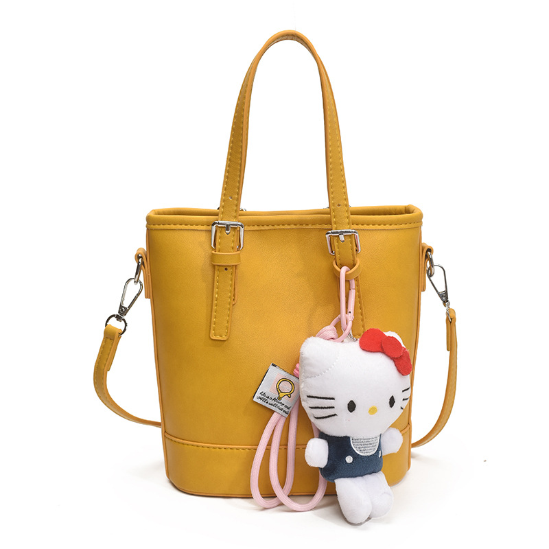 2025 nuevo bolso de cubo portátil de diseño de nicho bolso de hombro de viajero de todo fósforo de moda femenina bolso de mensajero de estilo occidental de color sólido