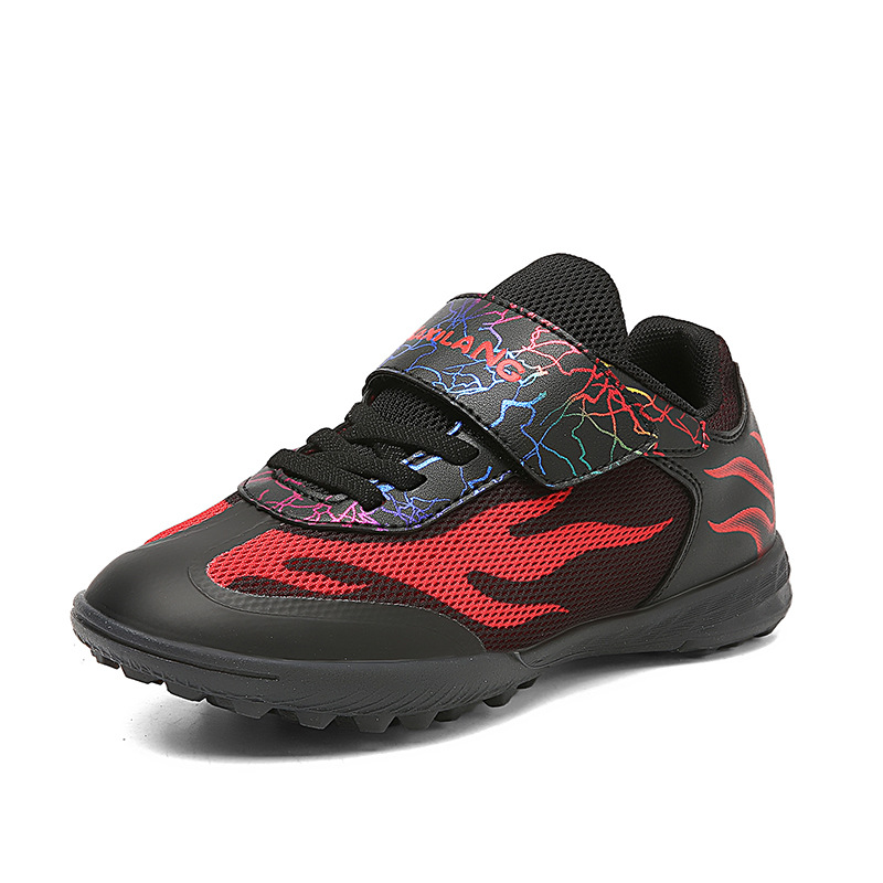 Nuevo transfronterizo niños y niñas transpirables cómodos deportes ociosos zapatos de fútbol clavos de hierba competencia de niños estudiantes fabricantes