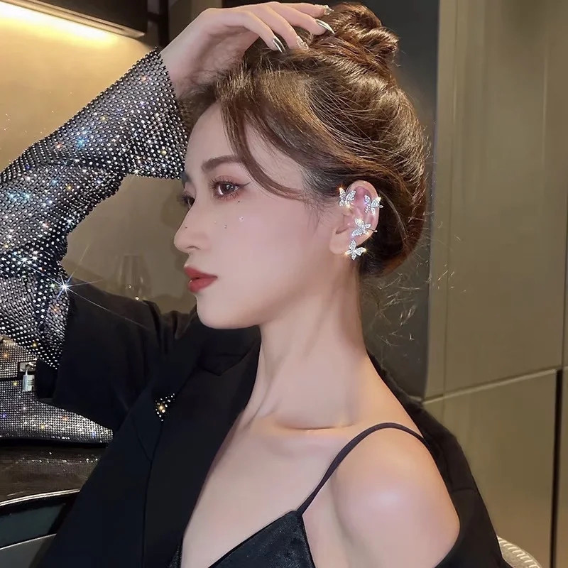 Tiktok popular Super Flash mariposa clip de oreja sin oreja hembra luz temperamento de lujo diseño de nicho clip de hueso de oreja de alta calidad