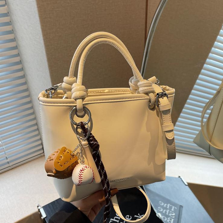 Bolso de mano súper caliente para mujeres 2025 nuevo estilo universal simple de hombro mochila de moda casual bolso de cubo