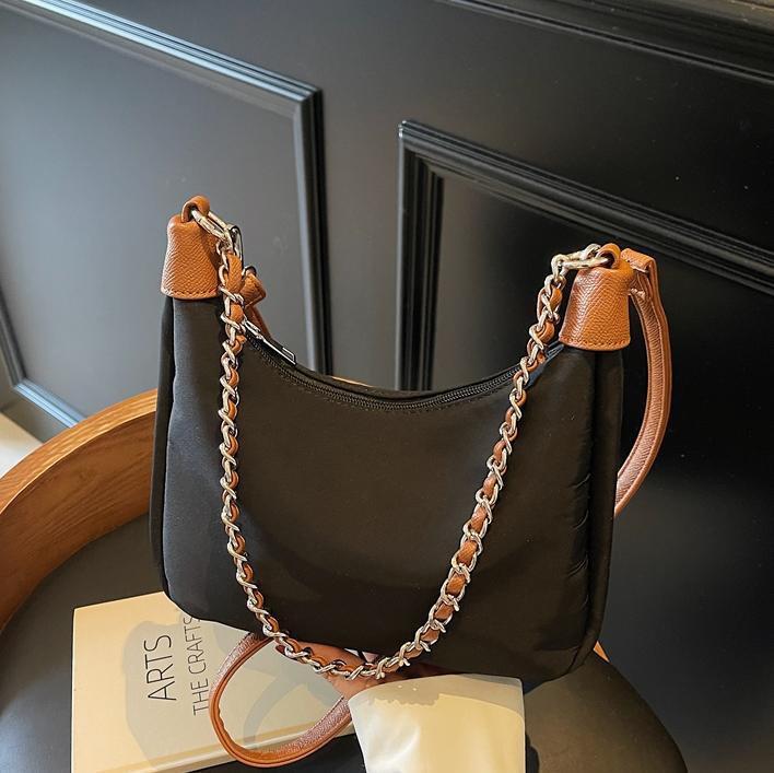 Bolso de axila simple de comercio exterior femenino 2025 nueva versión coreana de la bolsa de mensajero de viaje de trabajo bolso de alta capacidad de ocio