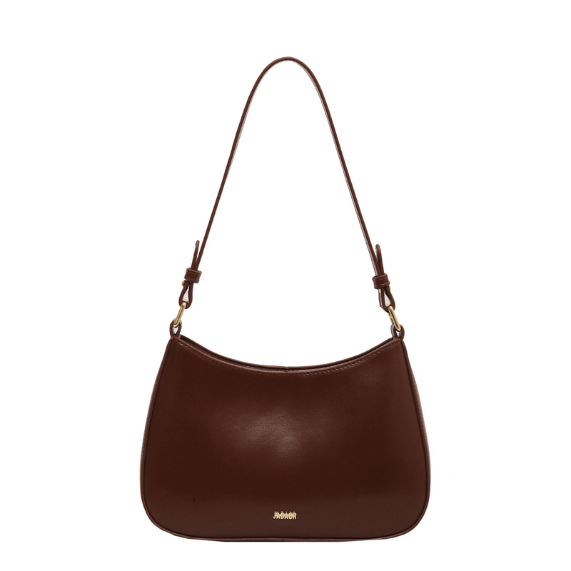 Bolso de moda de mujer 2024 verano nuevo estilo de moda bolso de brazo francés de textura simple bolso de palo nicho bolso de mochila