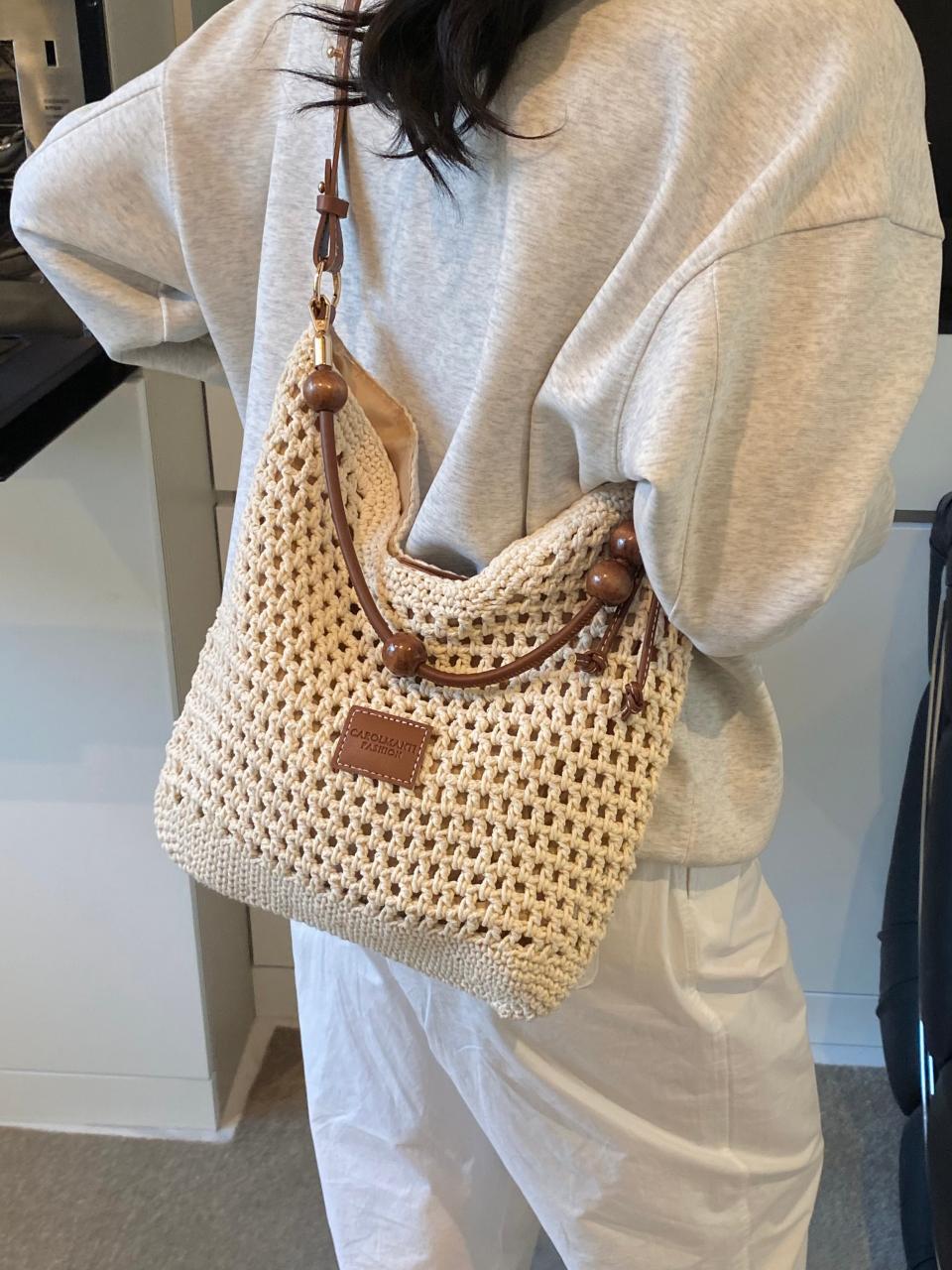 Bolso tejido hueco, verano femenino, nuevo estilo, bolso tejido de paja, bolso de mensajero de un solo hombro de gran capacidad, bolso de playa de vacaciones junto al mar